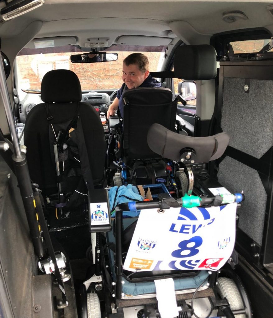 Dave Lewis inside his wheelchair accessible vehicle